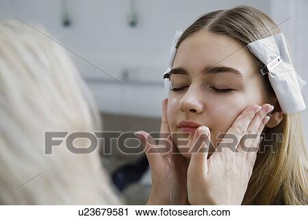 Stock Image - Model Having Makeup Applied. Fotosearch