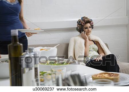 Model in Curlers on Cell Phone Near Lunch Buffet View Large Photo Image Stock Photo - Model in Curlers on Cell Phone Near Lunch Buffet. Fotosearch