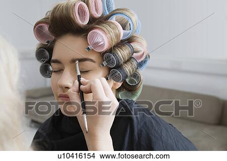Model in Hair Curlers Having Makeup Applied View Large Photo Image Picture - Model in Hair Curlers Having Makeup Applied. Fotosearch