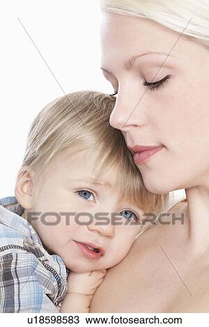 Mother cuddling son (1-2) close-up View Large Photo Image Stock Image - Mother cuddling son (1-2) close-up. Fotosearch
