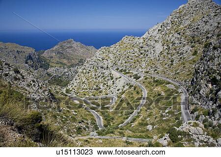 Mountain landscape with winding road View Large Photo Image Stock Image - Mountain landscape with winding road. Fotosearch