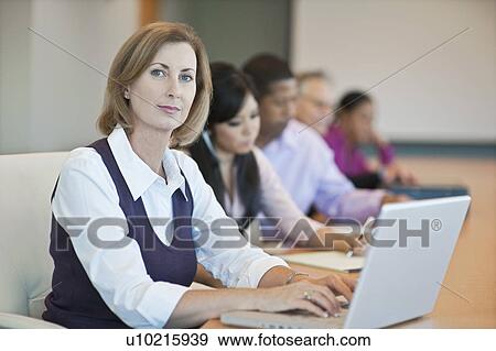 Multi Racial Group of Business People Working View Large Photo Image Stock Photo - Multi Racial Group of Business People Working. Fotosearch
