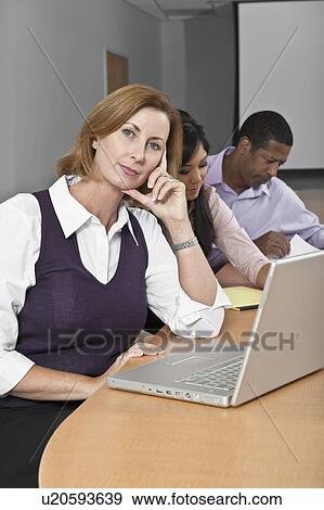 Multi Racial Group of Business People Working View Large Photo Image Stock Photo - Multi Racial Group of Business People Working. Fotosearch