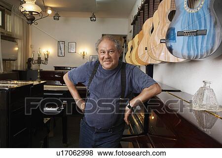 Stock Photo - Music Store Owner. Fotosearch