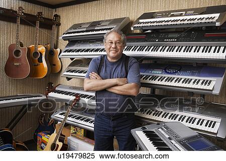 Stock Photography - Music Store Owner. Fotosearch