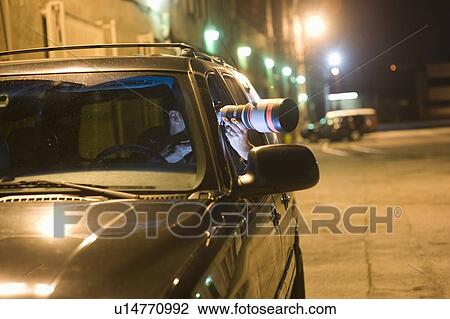 Paparazzi photographer in car View Large Photo Image Stock Image - Paparazzi photographer in car. Fotosearch