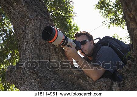 Paparazzi photographer View Large Photo Image Stock Image - Paparazzi photographer. Fotosearch
