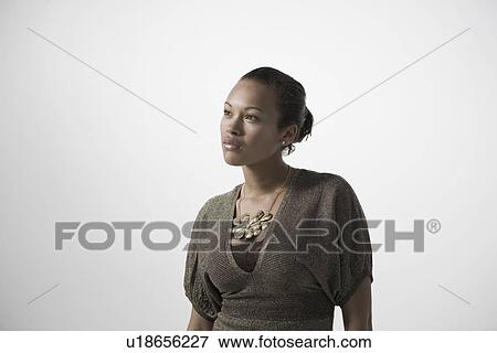 Pensive young woman close-up view View Large Photo Image Stock Photo - Pensive young woman close-up view. Fotosearch