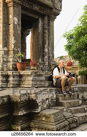 Photographer Sitting on Steps of Ancient Building View Large Photo Image Picture - Photographer Sitting on Steps of Ancient Building. Fotosearch