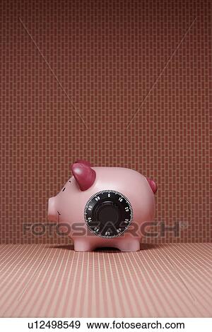 Piggy bank with combination lock side view View Large Photo Image Stock Photo - Piggy bank with combination lock side view. Fotosearch