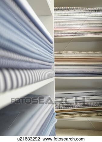 Piles of cotton fabric on shelfs View Large Photo Image Stock Image - Piles of cotton fabric on shelfs. Fotosearch