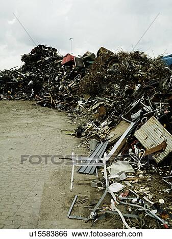 Stock Photograph - Piles of rubbish in scrapyard. Fotosearch