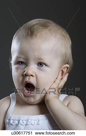Portrait of baby girl yawing View Large Photo Image Stock Image - Portrait of baby girl yawing. Fotosearch