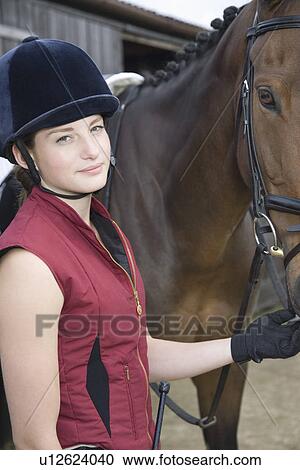 Portrait of girl holding horse outdoors View Large Photo Image Stock Image - Portrait of girl holding horse outdoors. Fotosearch