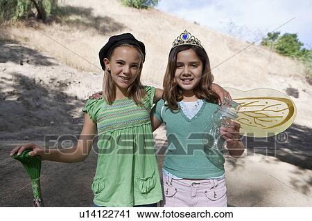 Stock Image - Portrait of girls (7-9) in costumes. Fotosearch