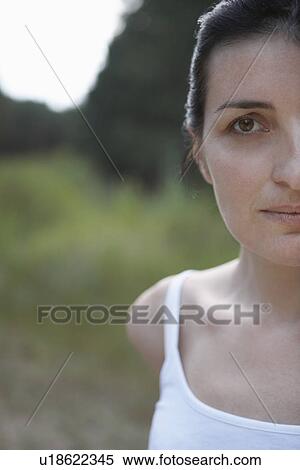 Stock Photography - Portrait of mid-adult woman outdoors close-up. Fotosearch