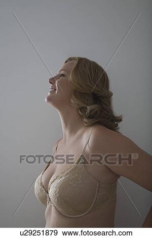 Stock Photo - Portrait of mid adult woman smiling. Fotosearch