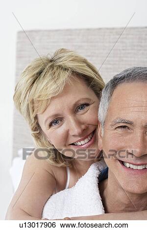 Portrait of middle-aged couple smiling View Large Photo Image Stock Photograph - Portrait of middle-aged couple smiling. Fotosearch