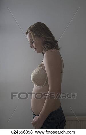 Stock Photo - Portrait of semi-dress mid adult woman. Fotosearch