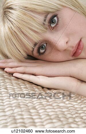 Portrait of teenage girl (16-17) lying on bed View Large Photo Image Stock Image - Portrait of teenage girl (16-17) lying on bed. Fotosearch