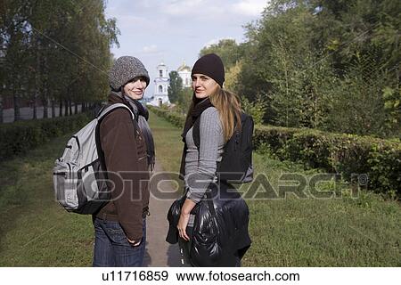 Stock Photo - Portrait of two girl friends in park. Fotosearch