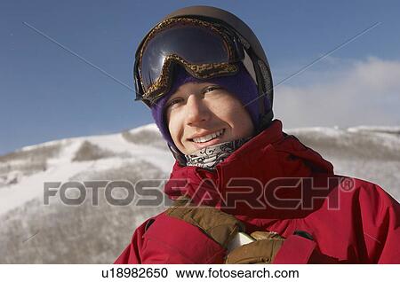Portrait of young snowboarder smiling View Large Photo Image Stock Image - Portrait of young snowboarder smiling. Fotosearch
