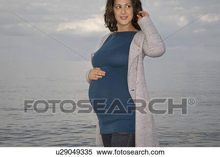 Pregnant woman at ocean View Large Photo Image Stock Photography - Pregnant woman at ocean. Fotosearch