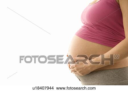Picture - Pregnant woman mid section. Fotosearch
