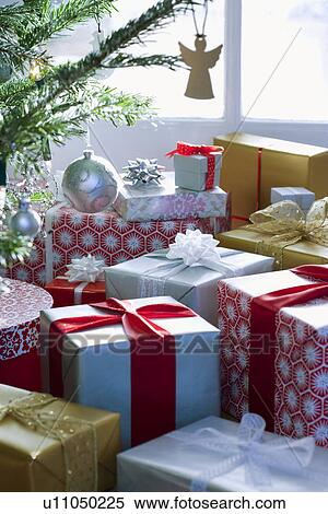 Stock Photography - Presents under Christmas tree. Fotosearch