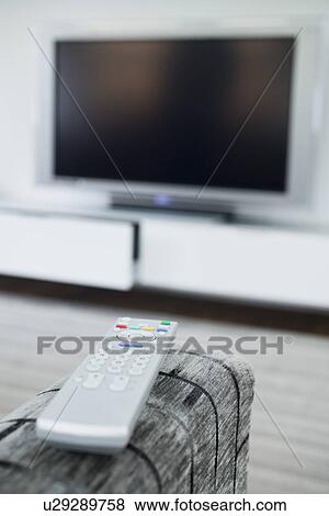 Stock Photo - Remote control and television set. Fotosearch