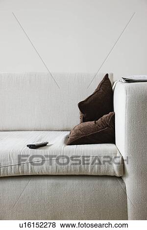 Remote control on sofa View Large Photo Image Stock Photo - Remote control on sofa. Fotosearch