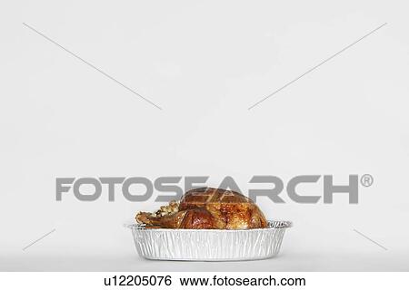 Roasted turkey in tinfoil pan View Large Photo Image Stock Photograph - Roasted turkey in tinfoil pan. Fotosearch