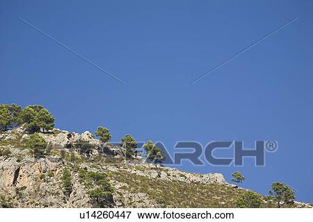 Stock Photo - Rocks and blue sky. Fotosearch