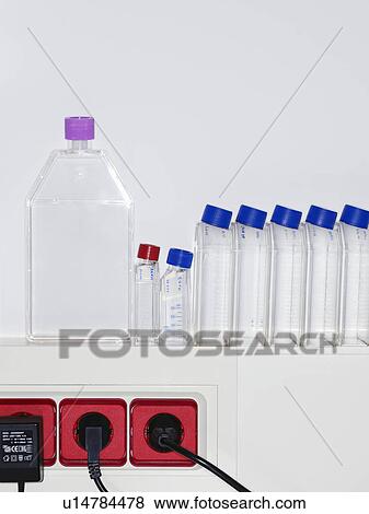 Stock Photo - Row of specimen bottles on ledge. Fotosearch