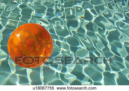 Stock Photography - Rubber ball floating in pool. Fotosearch