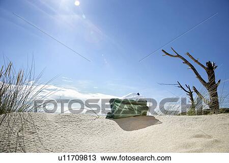 Rubbish bag on sand dune View Large Photo Image Stock Image - Rubbish bag on sand dune. Fotosearch