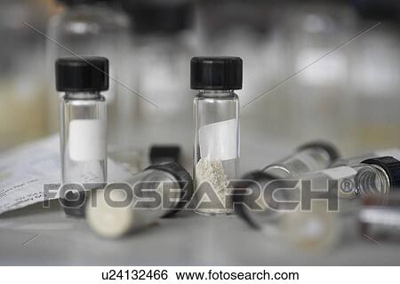 Sample bottles on table top close up View Large Photo Image Stock Photograph - Sample bottles on table top close up. Fotosearch