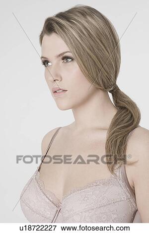 Sexy young woman wearing bra View Large Photo Image Stock Photo - Sexy young woman wearing bra. Fotosearch