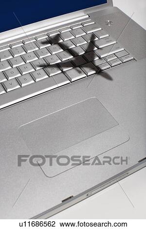 Shadow of jumbo jet over apple macintosh keyboard View Large Photo Image Stock Image - Shadow of jumbo jet over apple macintosh keyboard. Fotosearch