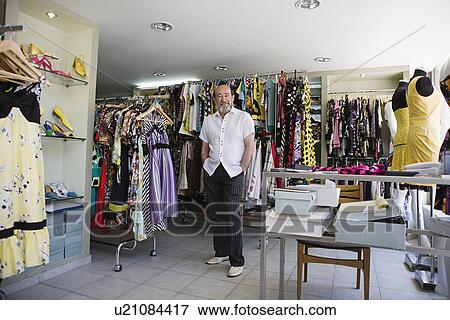 Shop Owner in Clothing Store View Large Photo Image Stock Photo - Shop Owner in Clothing Store. Fotosearch