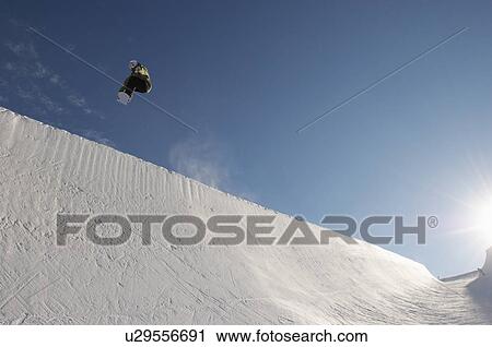Silhouette of teenage snowboarder on halfpipe View Large Photo Image Stock Image - Silhouette of teenage snowboarder on halfpipe. Fotosearch
