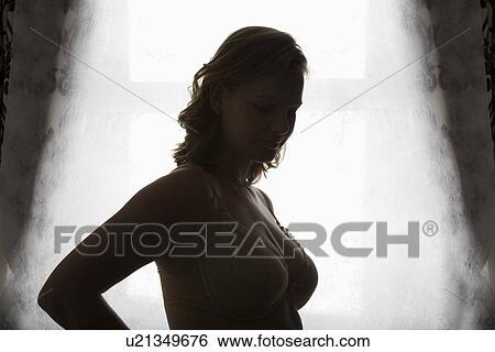 Stock Photograph - Silhouette portrait of semi-dress woman. Fotosearch
