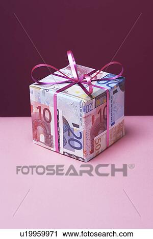 Small gift wrapped in Euro notes View Large Photo Image Stock Image - Small gift wrapped in Euro notes. Fotosearch