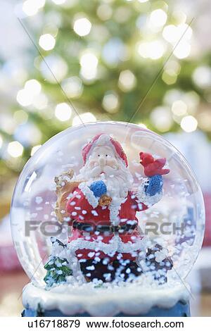 Stock Photo - Snow dome with Santa. Fotosearch