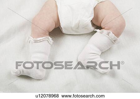 Socks on babies feet close-up View Large Photo Image Stock Photo - Socks on babies feet close-up. Fotosearch