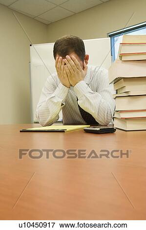 Stressed Businessman with Head in hands View Large Photo Image Stock Photo - Stressed Businessman with Head in hands. Fotosearch