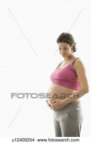 Picture - Studio portrait of pregnant woman. Fotosearch