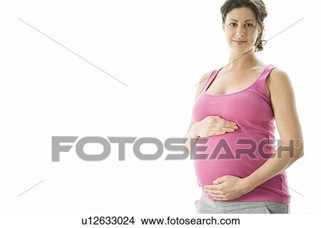 Picture - Studio portrait of pregnant woman. Fotosearch