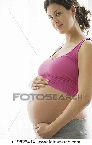 Studio portrait of pregnant woman View Large Photo Image Picture - Studio portrait of pregnant woman. Fotosearch