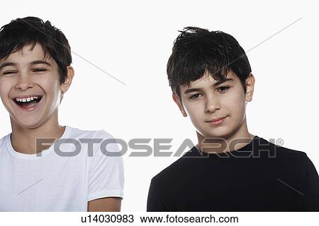 Studio portrait of twin boys (13-15) one laughing View Large Photo Image Stock Image - Studio portrait of twin boys (13-15) one laughing. Fotosearch